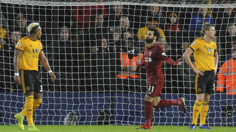 Liverpool's Mohamed Salah  celebrates after scoring his side's opening goal against Wolverhampton Wanderers.