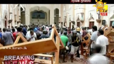 This image made from video provided by Hiru TV shows damage inside St Anthony's Shrine in Colombo.