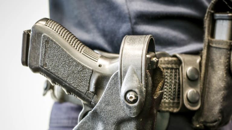 Queensland woman shot while checking on neighbour