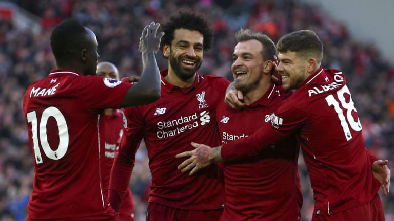 Superlative: Liverpool celebrating Xherdan Shaqiri's goal during the victory over Cardiff City.