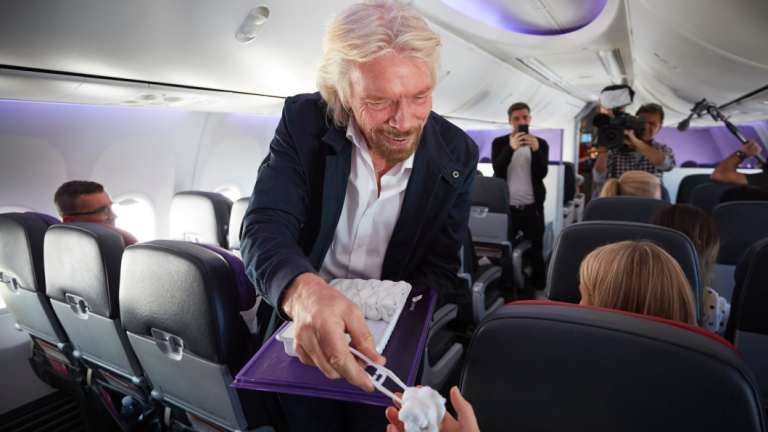 Hot towel boy: Sir Richard Branson handing a towel to Social Seen.