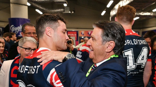Cooper Cronk with Nick Politis after the 2018 grand final.