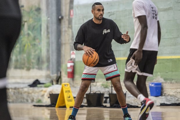 Australian tennis player Nick Kyrgios playing basketball with friends in The Rocks.
