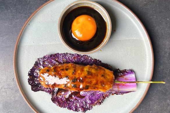 BBQ chicken and king prawn tsukune with cumquat glaze and soy cured egg at Babyface Kitchen.