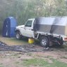 Russell Hill’s Toyota LandCruiser and the burnt campsite at Bucks Camp.