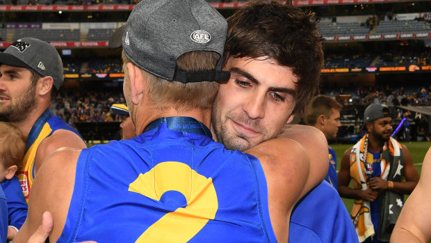 The suspended Andrew Gaff with teammate Mark LeCras after the grand final.