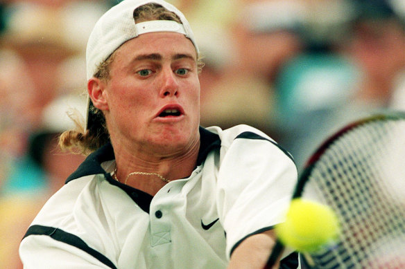 Lleyton Hewitt returns a serve to Patrick Rafter during the match in 1999.