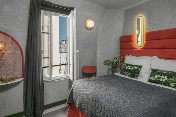 Eclectic interiors and bold hues in a Cosy Room at La Planque Hotel in Paris.