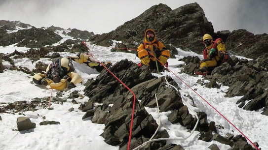 Two sherpas retrieve the body of Indian climber Goutam Ghosh (left) in May 2017. He had died near the summit a year earlier.
