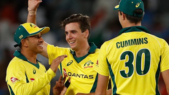 Australia's Jhye Richardson (centre) celebrates the dismissal of India's Mohammed Shami.