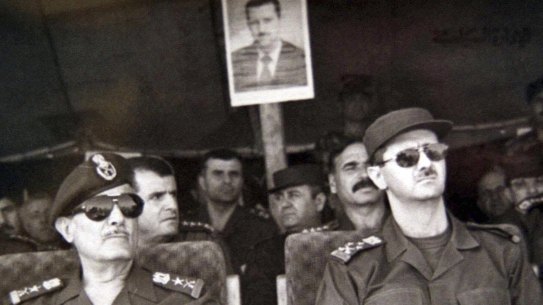  President-elect Lieutenant General Bashar al-Assad, right, attends military training games with Ali Aslan, Chief of Staff of the Syrian army, in 2000, in Syria.  