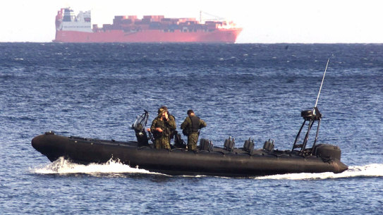 An Australian Army vessel patrols the waters near the Norwegian freighter Tampa in 2001. 