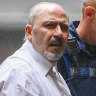 Tony Mokbel being led into court on Monday.