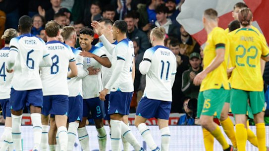The Socceroos look on as England celebrate Ollie Watkins’ goal at Wembley.