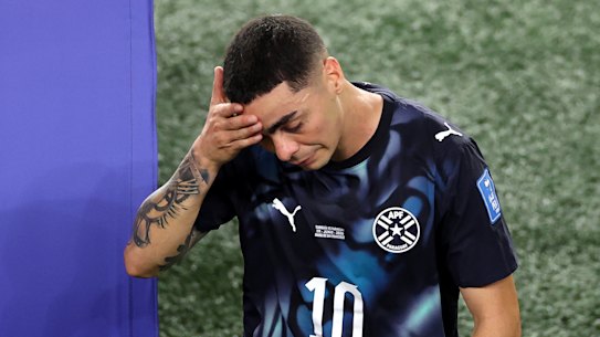 Miguel Almiron reacts after his red card.