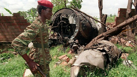 A Rwandan Patriotic Front rebel walks by the plane wreckage in which Rwanda's President Juvenal Habyarimana died on April 6, 1994, in Kigali.