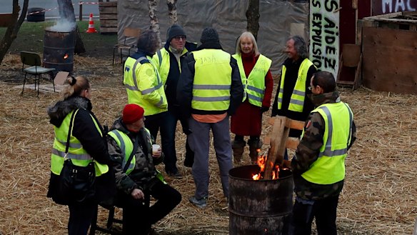 Protesters wearing yellow vests gather in a makeshift camp on a roundabout near Senlis, north of Paris, on Thursday.