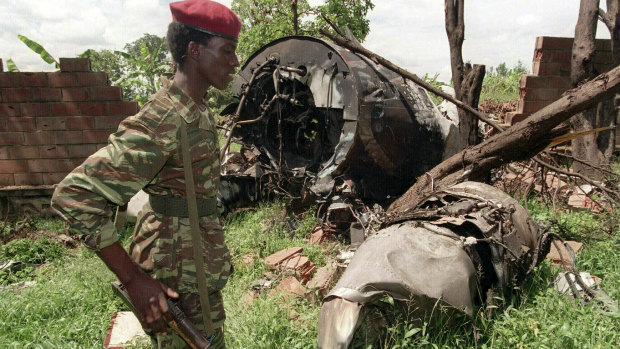 A Rwandan Patriotic Front rebel walks by the plane wreckage in which Rwanda's President Juvenal Habyarimana died on April 6, 1994, in Kigali.