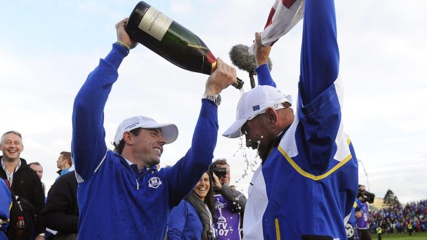 Teammates: Rory McIlroy (left) and Paul McGinley celebrate winning the 2014 Ryder Cup.