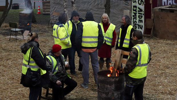 Protesters wearing yellow vests gather in a makeshift camp on a roundabout near Senlis, north of Paris, on Thursday.