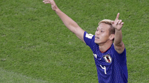 Keisuke Honda celebrates his goal for Japan in the 2018 World Cup. 
