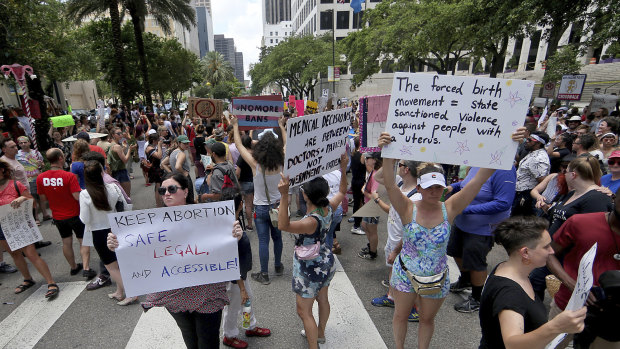 Hundreds of abortion-rights advocates block Poydras Street outside One Shell Square to protest anti-abortion legislation in New Orleans.