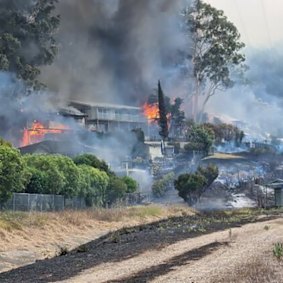 A photo taken by local Craig Gill, who escaped the Koolewong bushfire across the train tracks.