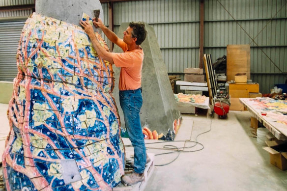 Simon Rigg working on The Guardians in his studio. The two sculptures were carved from white marble.