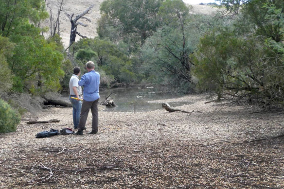 Catchment management staff on the dry Moorabool River bed in 2008 as water release from the Lal Lal Reservoir resumes following a period of drought.
