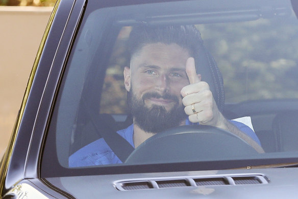 Chelsea's Olivier Giroud gives the thumbs-up as he left the club training centre this week.