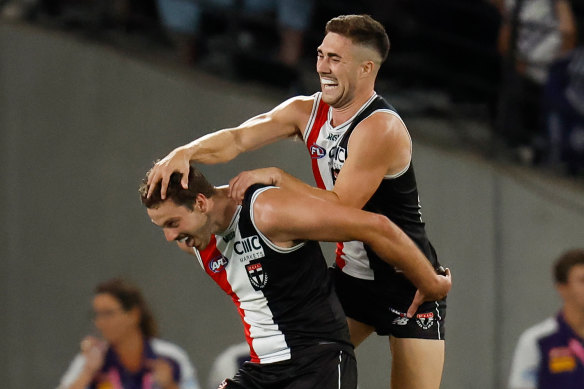 St Kilda recruit Zaine Cordy (left) celebrates a goal with new teammate Jade Gresham.