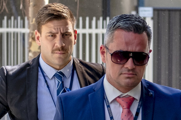  Detective Senior Constable Murray Gentner (right) and Senior Constable Jake Semmel (left) arriving at the Coroner's Court to give evidence on Thursday.