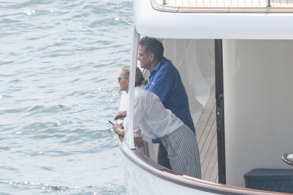 Lachlan Murdoch and wife Sarah on a yacht in Sydney Harbour last Friday.