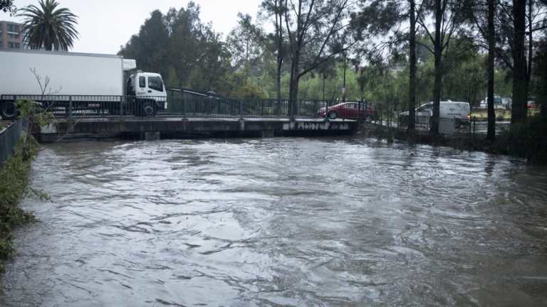 Weather. Johnson creek, Annandale, floods as an east coast low envelops Sydney.