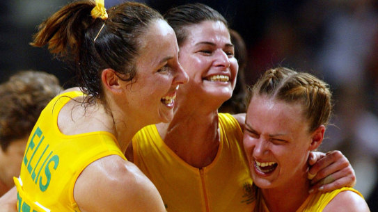 Australian netballers Liz Ellis (L), captain Kathryn Harby-Williams (C) and Sharelle McMahon  (R) embrace after their gold medal victory against New Zealand in the women’s’ netball final at the 2002 Commonwealth Games in Manchester.