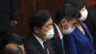 Japanese Prime Minister Fumio Kishida, centre, and other lawmakers speak after dissolving the lower house.