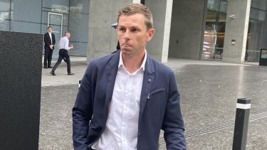 Brett Holman leaves Brisbane District Court on Thursday after a full-day civil hearing in his debt claim.