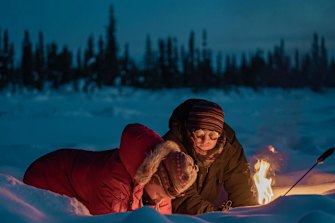 Aquatic Biologist Dr Katey Walter Anthony lights methane under the Alaskan ice..