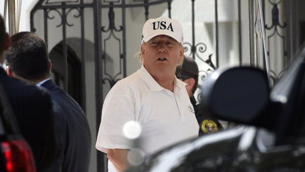 President Donald Trump heads into the White House on Sunday after spending the day golfing.