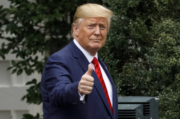 Trump gives the thumbs-up as he arrives for a ceremony on the South Lawn of the White House on Thursday.