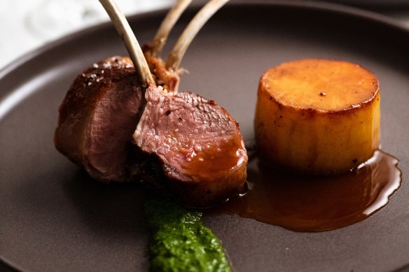 Lamb cutlets with fondant potato and jus.