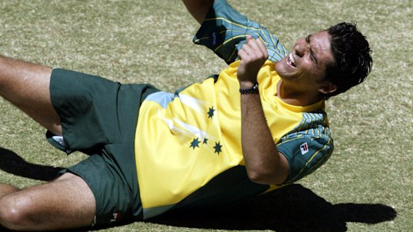 Proud moment: Philippoussis celebrates his victory over Spain's Juan Carlos Ferrero to seal the Davis Cup for Australia in Melbourne in 2003.