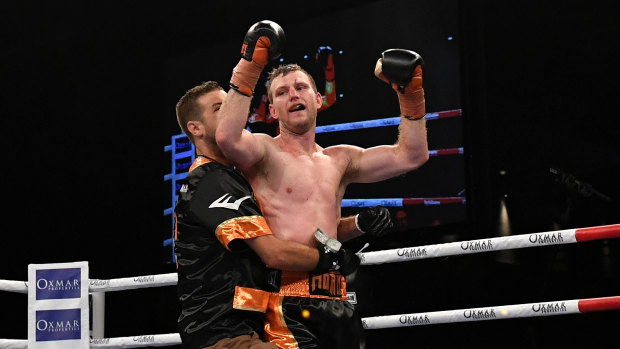 Ben Horn embraces Jeff Horn following his first title defence.