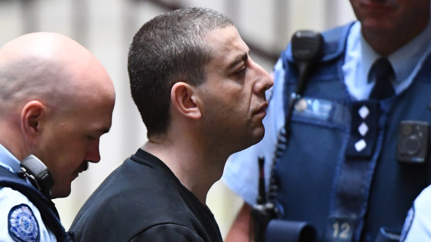 Ali Chaouk (centre) arrives at the Supreme Court ahead of his murder conviction in late 2018.