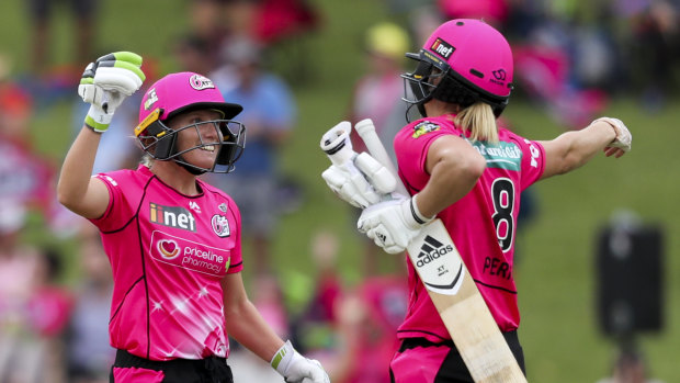 Dynamic duo: Alyssa Healy and Perry react after winning the super over.