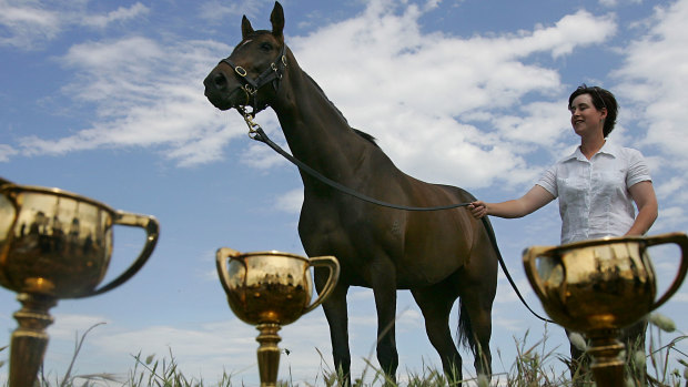 Makybe Diva, with her Cups and strapper Christine Mitchell at trainer Lee Freedman's Rye property in 2005.