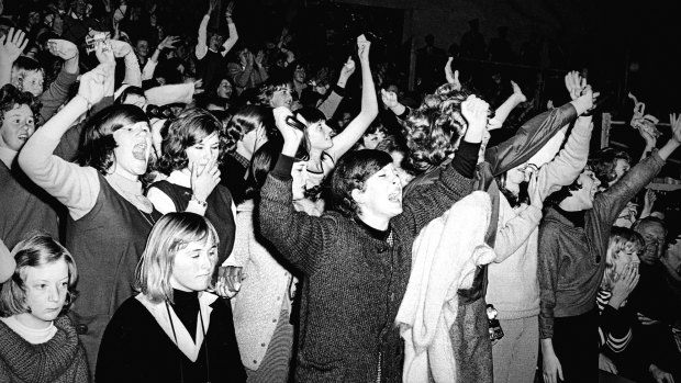 Crowds scream in delight as the Beatles perform at Sydney Stadium, 18 June, 1964. 