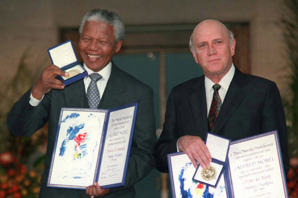 FW de Klerk, right, and Nelson Mandela pose with their Nobel Peace Prize Gold Medal and Diplomas, in Oslo, in 1993.