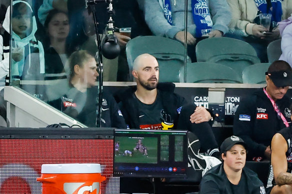Steele Sidebottom watches from the sidelines after being subbed out of his milestone match with a knee injury.