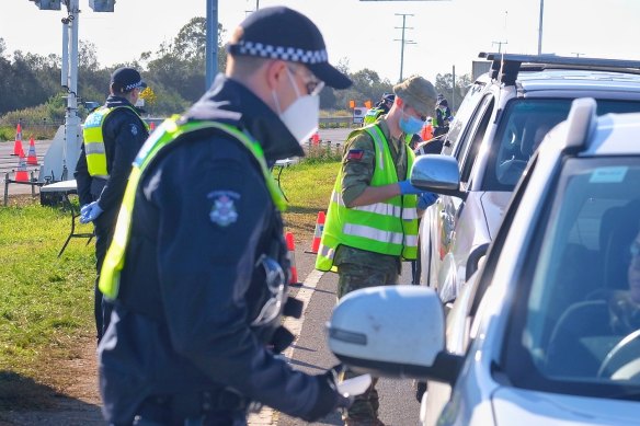 Police and ADF personnel at a checkpoint on Melbourne’s outskirts in July last year.